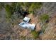 Aerial view of a property with two structures nestled amidst dense trees, ensuring complete privacy at 1004 Kings Mill Rd, Chapel Hill, NC 27517