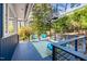 Outdoor deck showcasing a spiral staircase, seating area, and natural views, perfect for relaxing or entertaining at 1004 Kings Mill Rd, Chapel Hill, NC 27517