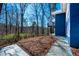 Backyard featuring a patio and wooded view of the surrounding landscape at 1004 Kings Mill Rd, Chapel Hill, NC 27517