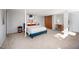 Spacious bedroom featuring a bed, desk area and neutral decor at 1004 Kings Mill Rd, Chapel Hill, NC 27517