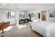 Bright bedroom with neutral carpet, large windows, and exercise space at 1004 Kings Mill Rd, Chapel Hill, NC 27517