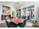 Charming dining area with a fireplace, views to the living room, and sliding doors to the deck at 1004 Kings Mill Rd, Chapel Hill, NC 27517
