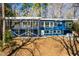 Rear exterior view showcasing the decks, and hot tub at 1004 Kings Mill Rd, Chapel Hill, NC 27517