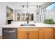 Bright kitchen features stainless steel appliances, a modern faucet, and white countertops for a sleek design at 1004 Kings Mill Rd, Chapel Hill, NC 27517