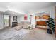 Basement living room featuring a fireplace with candles and an adjacent kitchen at 1004 Kings Mill Rd, Chapel Hill, NC 27517