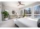 Bright main bedroom with large windows, neutral tones, and minimalist decor create a relaxing atmosphere at 1004 Kings Mill Rd, Chapel Hill, NC 27517