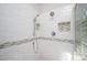 Modern shower with white subway tiles and stylish accent trim at 1004 Kings Mill Rd, Chapel Hill, NC 27517