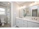 Bathroom features a double vanity and shower-tub combo at 104 Buckden Pl, Cary, NC 27518