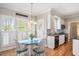 Charming breakfast nook with lots of natural light and hardwood floors at 104 Buckden Pl, Cary, NC 27518
