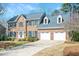 Beautiful brick home with a two-car garage and a spacious driveway at 104 Buckden Pl, Cary, NC 27518