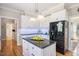 Well-lit kitchen features granite countertops, stainless steel appliances, and ample cabinet space at 104 Buckden Pl, Cary, NC 27518