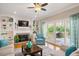 Cozy living room with fireplace, built-in shelving and sliding doors to outdoor deck at 104 Buckden Pl, Cary, NC 27518