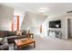 Upstairs living room features a TV, couch, and a cozy atmosphere at 104 Buckden Pl, Cary, NC 27518