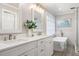Modern bathroom boasts double vanity, soaking tub, and separate shower, for a spa-like retreat at 104 Buckden Pl, Cary, NC 27518
