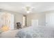 Spacious bedroom features a ceiling fan, ensuite bathroom, and closet at 104 Buckden Pl, Cary, NC 27518