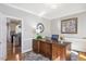 Office space with a large wooden desk and beautiful natural lighting at 104 Buckden Pl, Cary, NC 27518