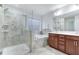 Luxurious bathroom with a glass shower, soaking tub, and double sink vanity at 104 Red Bark Ct, Apex, NC 27539