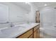 Well-lit bathroom boasts a double sink vanity and a shower-tub combination at 104 Red Bark Ct, Apex, NC 27539