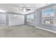 Spacious bedroom with light blue walls, carpet, ceiling fan, and white built-in closet at 104 Red Bark Ct, Apex, NC 27539