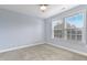 Cozy bedroom is a peaceful retreat with neutral paint and natural light at 104 Red Bark Ct, Apex, NC 27539
