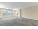 Large bonus room with carpet, three windows, and neutral wall color at 104 Red Bark Ct, Apex, NC 27539