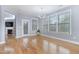 Bright dining room with hardwood floors and large windows at 104 Red Bark Ct, Apex, NC 27539