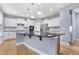 Modern kitchen featuring stainless steel appliances, granite countertops, and ample cabinet space at 104 Red Bark Ct, Apex, NC 27539