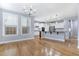 Open-concept kitchen with stainless steel appliances and granite countertops at 104 Red Bark Ct, Apex, NC 27539