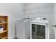 Well-equipped laundry room includes a washer and dryer for convenience at 104 Red Bark Ct, Apex, NC 27539