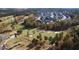 Beautiful aerial view of the golf course community with lush greenery and modern homes at 104 Sage Oak Ln, Holly Springs, NC 27540