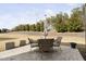 Cozy backyard patio with outdoor seating, perfect for entertaining and relaxation at 104 Sage Oak Ln, Holly Springs, NC 27540