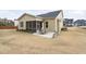 Expansive backyard featuring a patio, screened-in porch, and plenty of space for outdoor activities at 104 Sage Oak Ln, Holly Springs, NC 27540