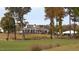 Beautiful community clubhouse with manicured lawn, perfect for events and gatherings at 104 Sage Oak Ln, Holly Springs, NC 27540