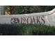 Elegant brick community sign, '12 Oaks', surrounded by lush greenery at 104 Sage Oak Ln, Holly Springs, NC 27540