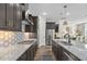Bright kitchen features granite countertops, a gas range, stainless steel appliances, and ample cabinet storage at 104 Sage Oak Ln, Holly Springs, NC 27540