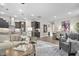 Open floor plan featuring the living room, kitchen, and dining area offers great natural light and flow at 104 Sage Oak Ln, Holly Springs, NC 27540