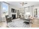 Comfortable living room with a fireplace, plush seating, and neutral decor at 104 Sage Oak Ln, Holly Springs, NC 27540