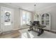 Bright home office with a large window, modern desk, and stylish white cabinets at 104 Sage Oak Ln, Holly Springs, NC 27540