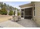 Inviting patio with comfortable seating near a screened-in porch for relaxing outdoors at 104 Sage Oak Ln, Holly Springs, NC 27540