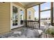 Screened porch with a table and chairs, offering a picturesque view at 104 Sage Oak Ln, Holly Springs, NC 27540