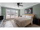Inviting bedroom with natural light, plush carpeting, and neutral décor at 104 Somerset Farm Dr, Holly Springs, NC 27540