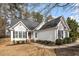 Charming home with a well-maintained lawn, attractive landscaping and inviting walkway at 104 Somerset Farm Dr, Holly Springs, NC 27540