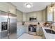 Well-equipped kitchen featuring modern appliances and countertops at 104 Somerset Farm Dr, Holly Springs, NC 27540