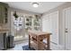Bright breakfast nook featuring large windows and a wooden island with storage at 104 Somerset Farm Dr, Holly Springs, NC 27540