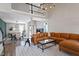 Open-concept living room with a fireplace, staircase and adjoining dining area at 104 Somerset Farm Dr, Holly Springs, NC 27540