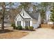 Well-maintained home with attached garage and a driveway at 104 Somerset Farm Dr, Holly Springs, NC 27540