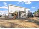 Backyard featuring a play set, a trampoline, and a covered patio at 106 Capanne Ct, Clayton, NC 27527
