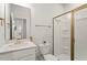 Bathroom featuring modern fixtures, tiled shower, and neutral decor at 106 Capanne Ct, Clayton, NC 27527