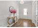 Elegant entryway with wood floors and decorative console table at 106 Capanne Ct, Clayton, NC 27527