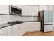 Spacious kitchen featuring granite countertops, stainless steel appliances, and white subway tile backsplash at 106 Capanne Ct, Clayton, NC 27527